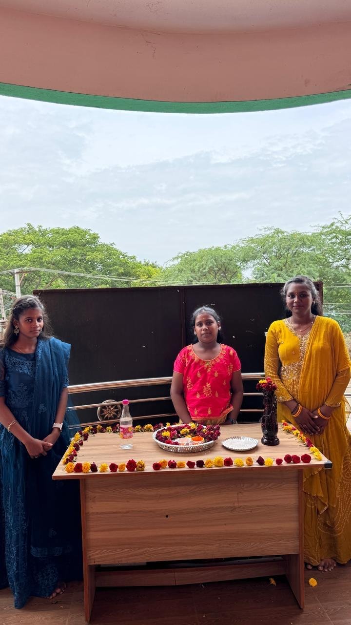 Students celebrating together in a classroom at Kanavugal Academy