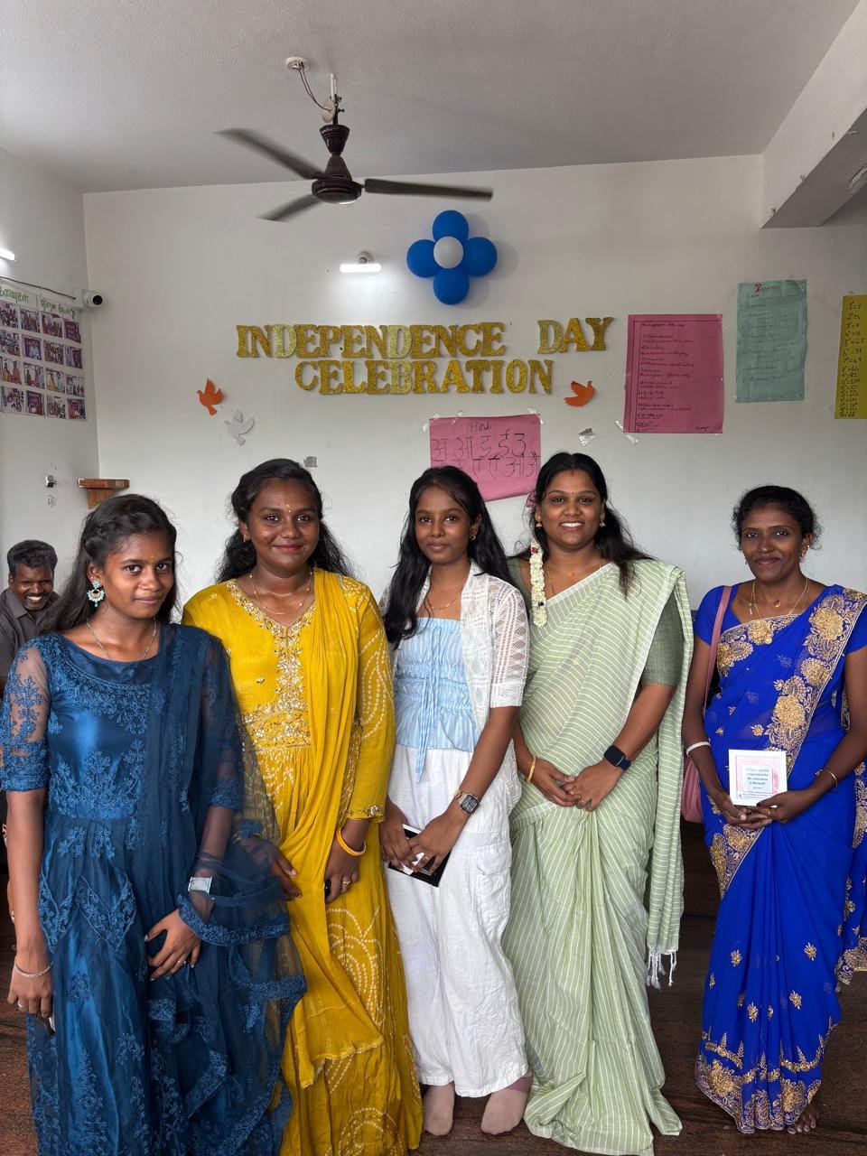 Students celebrating together in a classroom at Kanavugal Academy