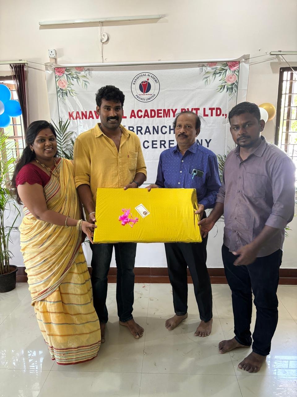 Students celebrating together in a classroom at Kanavugal Academy