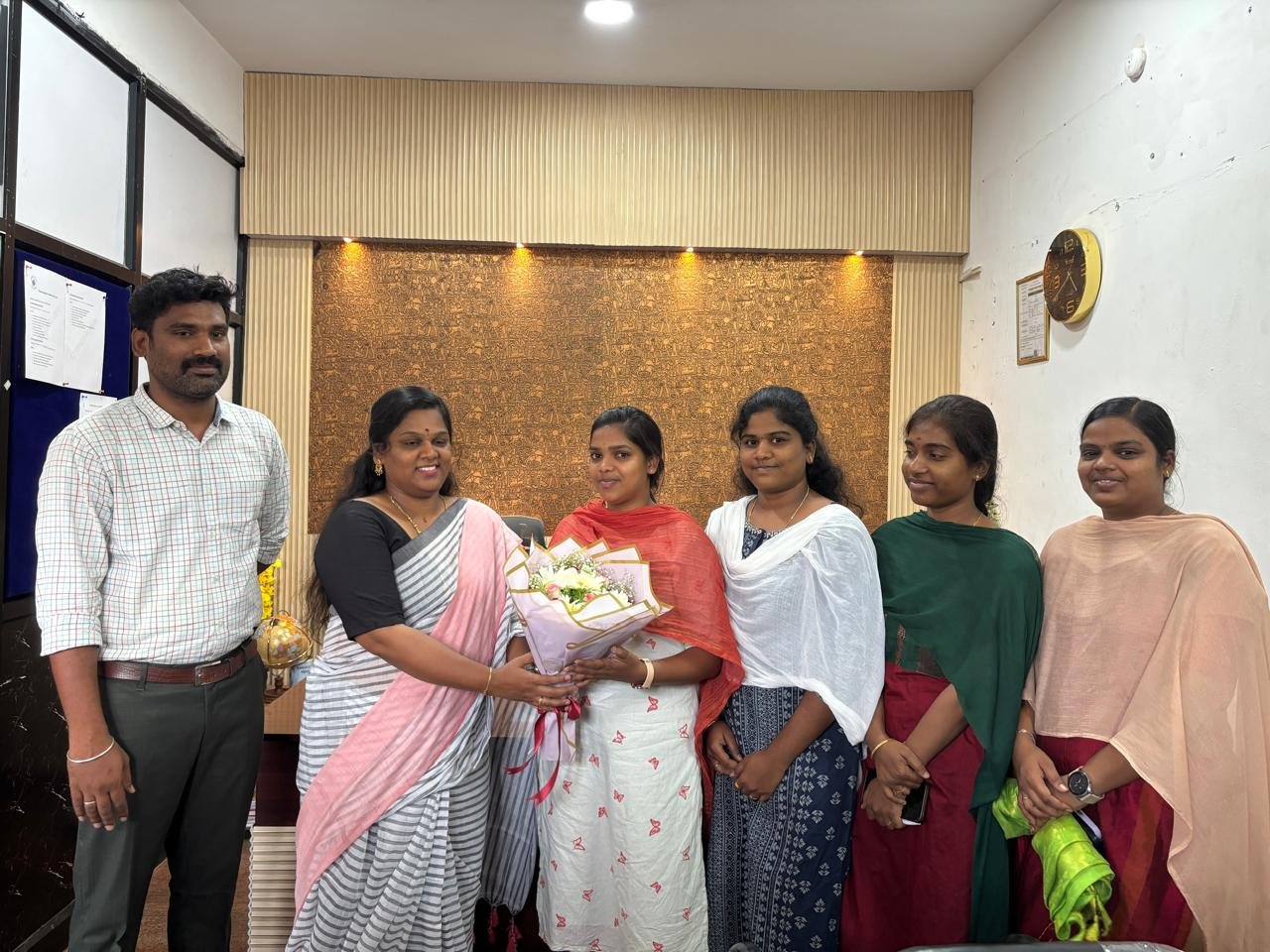 Students celebrating together in a classroom at Kanavugal Academy