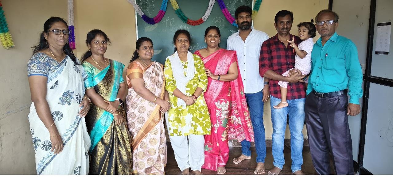 Students celebrating together in a classroom at Kanavugal Academy