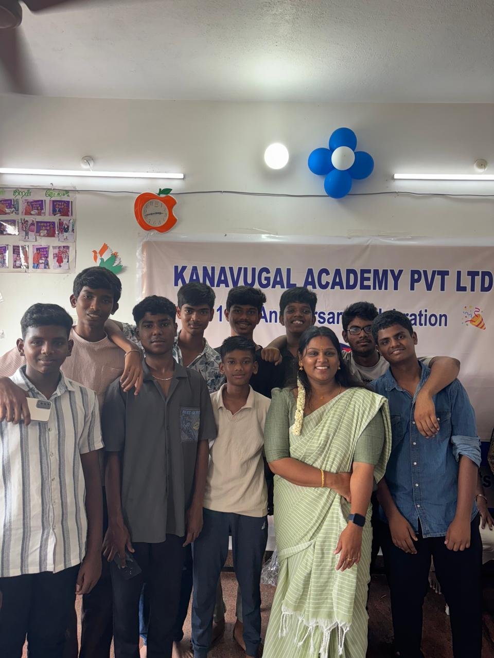 Students celebrating together in a classroom at Kanavugal Academy